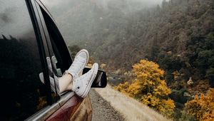 Preview wallpaper feet, sneakers, journey, fog, car