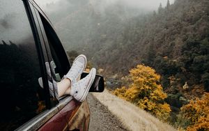 Preview wallpaper feet, sneakers, journey, fog, car