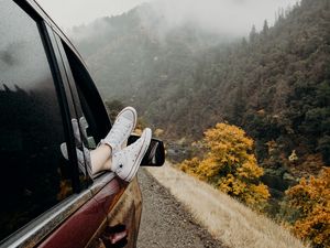 Preview wallpaper feet, sneakers, journey, fog, car