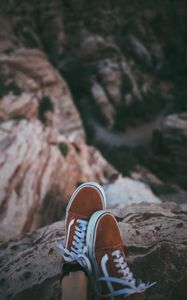 Preview wallpaper feet, sneakers, red, stones, rocks