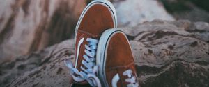 Preview wallpaper feet, sneakers, red, stones, rocks