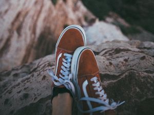 Preview wallpaper feet, sneakers, red, stones, rocks