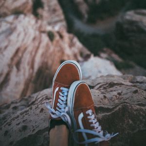 Preview wallpaper feet, sneakers, red, stones, rocks