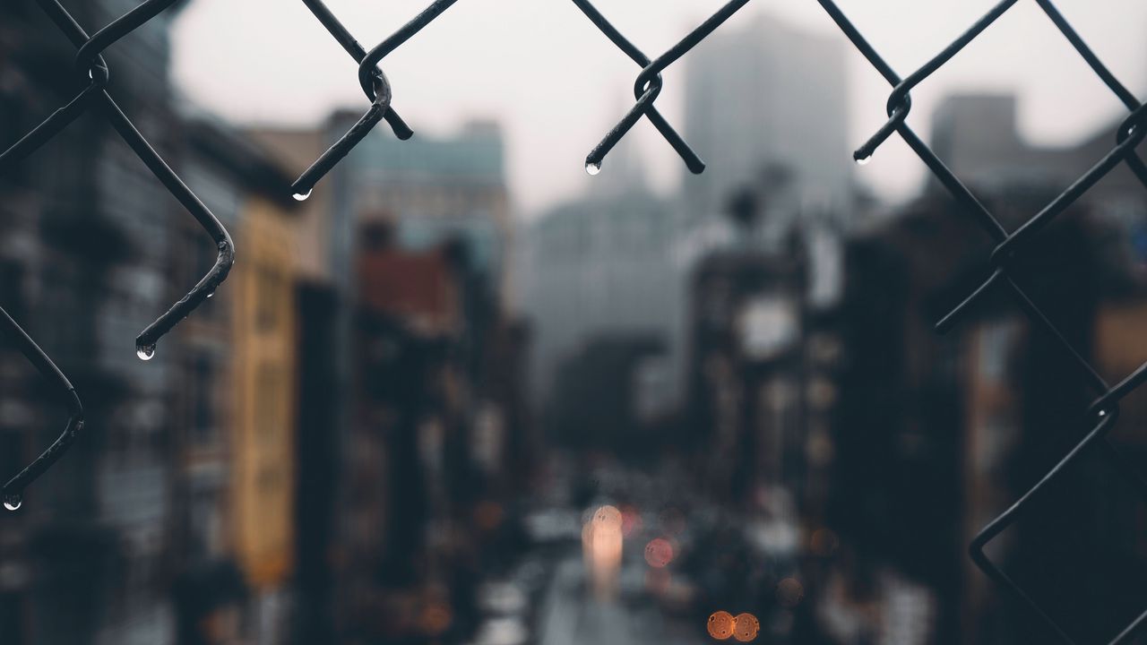 Wallpaper fence, grid, hole, rain, city, blur