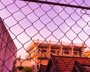 Preview wallpaper fence, mesh, building, sky, pink