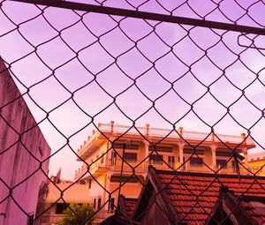 Preview wallpaper fence, mesh, building, sky, pink