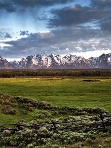 Preview wallpaper fence, mountains, field, pasture, clouds