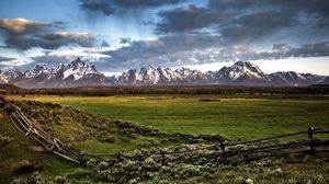 Preview wallpaper fence, mountains, field, pasture, clouds