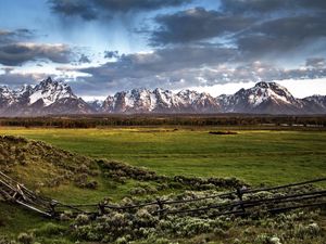 Preview wallpaper fence, mountains, field, pasture, clouds