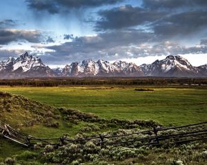 Preview wallpaper fence, mountains, field, pasture, clouds