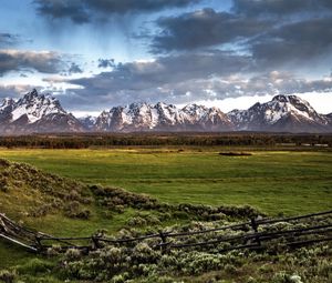 Preview wallpaper fence, mountains, field, pasture, clouds