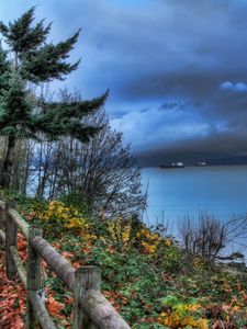 Preview wallpaper fence, park, sea, ships, cloudy