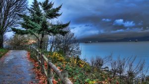 Preview wallpaper fence, park, sea, ships, cloudy