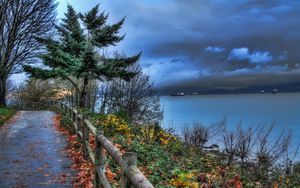 Preview wallpaper fence, park, sea, ships, cloudy