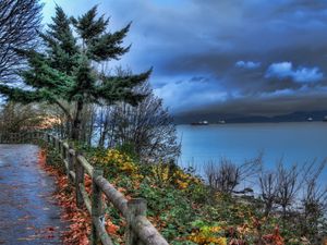 Preview wallpaper fence, park, sea, ships, cloudy