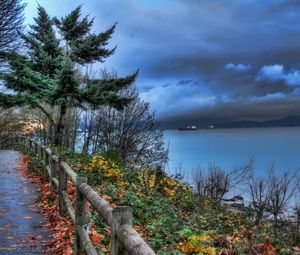 Preview wallpaper fence, park, sea, ships, cloudy