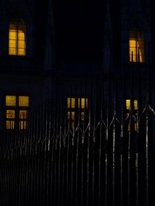 Preview wallpaper fence, spikes, building, windows, night, dark