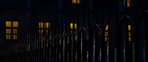 Preview wallpaper fence, spikes, building, windows, night, dark