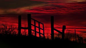 Preview wallpaper fence, sunset, evening, silhouettes, grass