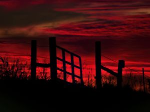 Preview wallpaper fence, sunset, evening, silhouettes, grass