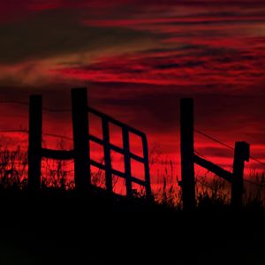 Preview wallpaper fence, sunset, evening, silhouettes, grass