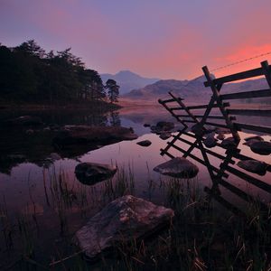 Preview wallpaper fence, water, stones, morning, mountains, wood