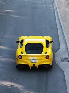 Preview wallpaper ferrari, car, sports car, yellow, aerial view