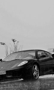 Preview wallpaper ferrari, rain, building, black and white