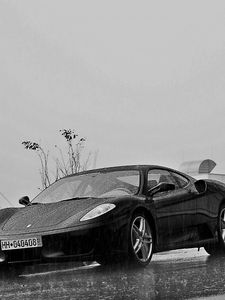 Preview wallpaper ferrari, rain, building, black and white