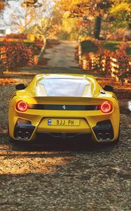 Preview wallpaper ferrari, sports car, yellow, rear view