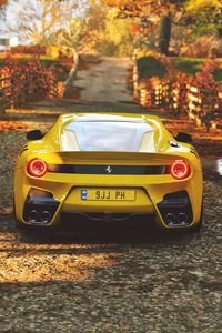 Preview wallpaper ferrari, sports car, yellow, rear view