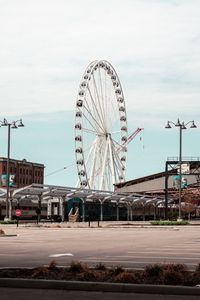 Preview wallpaper ferris wheel, attraction, buildings, parking