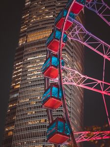 Preview wallpaper ferris wheel, building, skyscraper, backlight, night