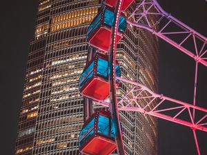 Preview wallpaper ferris wheel, building, skyscraper, backlight, night