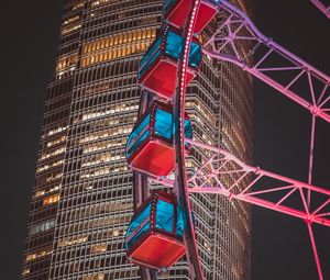 Preview wallpaper ferris wheel, building, skyscraper, backlight, night