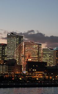 Preview wallpaper ferris wheel, buildings, houses, lights, evening, city