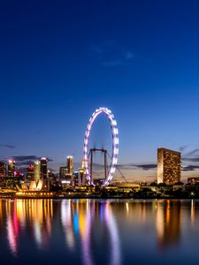 Preview wallpaper ferris wheel, night city, skyscrapers, ocean, beach