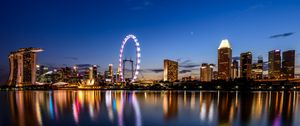 Preview wallpaper ferris wheel, night city, skyscrapers, ocean, beach