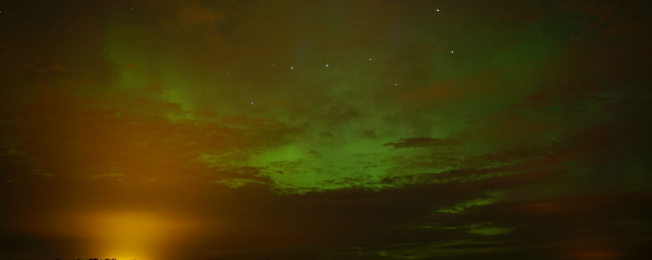 2560x1024 Wallpaper field, clouds, sunset, northern lights, stars, sky, dark