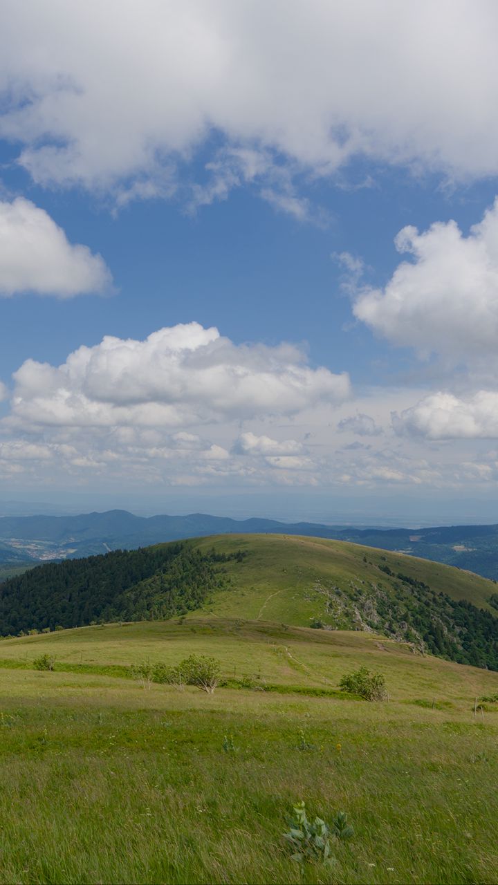 720x1280 Wallpaper field, grass, mountains, clouds, sky, landscape