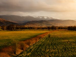 Preview wallpaper field, grass, mountains, hills, landscape