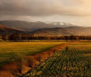 Preview wallpaper field, grass, mountains, hills, landscape