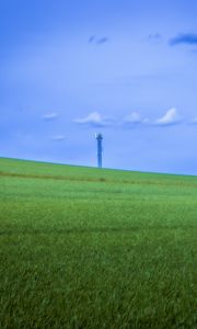 Preview wallpaper field, grass, tower, sky, nature, minimalism