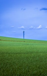 Preview wallpaper field, grass, tower, sky, nature, minimalism