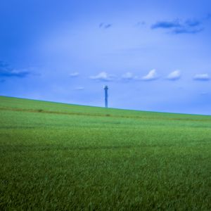 Preview wallpaper field, grass, tower, sky, nature, minimalism