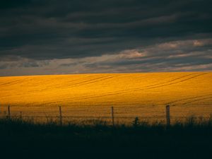 Preview wallpaper field, hill, clouds, dark, landscape