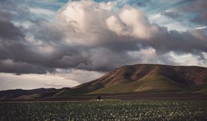 Preview wallpaper field, hills, clouds, landscape, relief