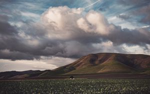 Preview wallpaper field, hills, clouds, landscape, relief