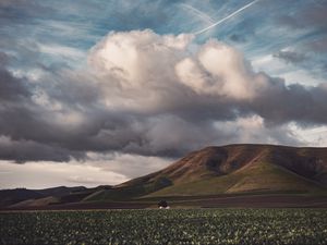 Preview wallpaper field, hills, clouds, landscape, relief