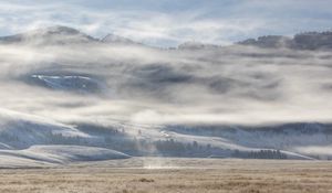 Preview wallpaper field, hills, clouds, snow, landscape